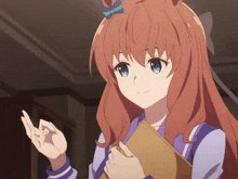 a girl with red hair and blue eyes is holding a piece of paper