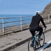 a person riding a bike with a helmet on that says ' salomon ' on it