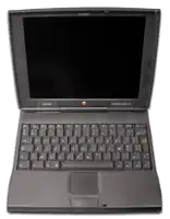 a black macbook with a black keyboard and an apple logo