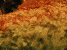 a blurred image of a fire with a green background
