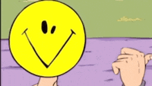 a cartoon character with a smiley face on his face .