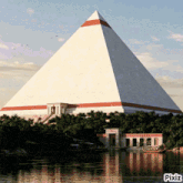 a large white pyramid is surrounded by palm trees and a body of water with pixiz written below it