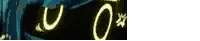 a blurry picture of a person 's face with a yellow light coming out of it