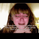 a girl is crying with the words " why everyone is so fucking unfair to me " written above her