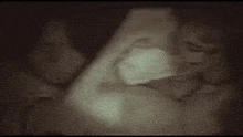 a close up of a person 's face with a blurred background .