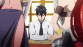 a man in a white shirt and tie sits at a table surrounded by two women