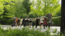 a group of people are dancing in a park with trees in the background and a caption that says " beyondthesuperhero "