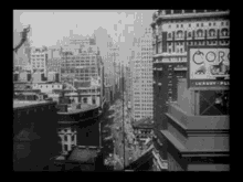 a black and white photo of a city with a cork sign