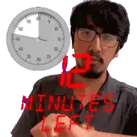a man wearing glasses stands in front of a clock that says 12 minutes left