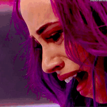 a close up of a woman 's face with purple hair and the words " the next thing " at the bottom