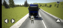 a man is standing in front of a blue truck on a road