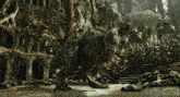 a t-rex is walking through a cave surrounded by trees