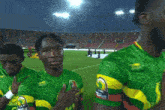 a man wearing a green and yellow jersey with a lion on it is standing on a soccer field