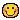 a pixel art smiley face with a blurred background .