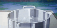 a pot of water is sitting on a stove top .