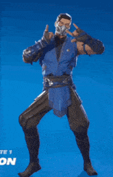 a man with a mask on his face is holding a stick