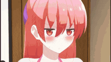 a close up of a pink haired anime girl with red eyes and red cheeks .