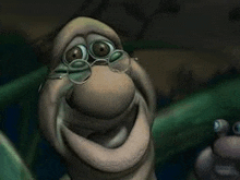 a cartoon worm wearing glasses and smiling .