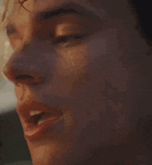 a close up of a man 's face with water dripping from his nose