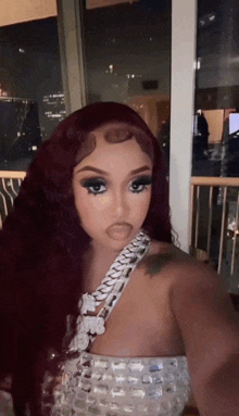 a woman with red hair is taking a selfie