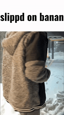 a person standing in the snow with the words slippd on banana on the top