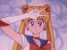 a girl in a sailor suit making a peace sign with her hand