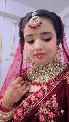 a woman with a nose ring and a necklace