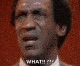 a man is making a surprised face and saying `` what ! ''