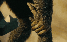 a close up of a person holding another person 's hand in a movie .
