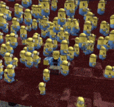 a bunch of minions are sitting in a row