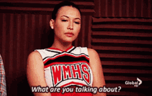 a cheerleader wearing a wmhs shirt is talking about something