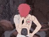 a person with red hair has a tattoo on their back