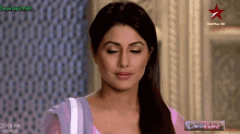 a woman 's face is shown on a star plus hd channel
