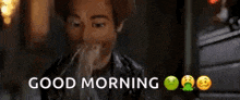 a man is sitting in front of a window with the words `` good morning '' written above him .