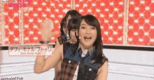 a girl with the name devi kinal putri written on her shirt