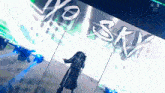 a person is standing in front of a sign that says yo sky