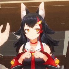 a girl with a fox ear and red hair making a peace sign