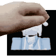a hand is holding a piece of paper over a picture of a man 's face .