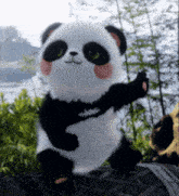 a stuffed panda bear with green eyes is sitting on a log