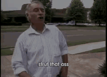 a man says strut that ass in front of a building