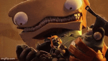 a cartoon character is holding a smaller character in his hands .