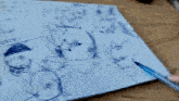 a piece of paper with drawings on it including a drawing of a cat