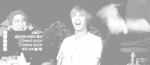 a black and white photo of a man giving a high five .