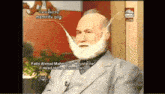 a man with a fake beard is on a television show