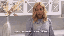 a woman says " are you serious right now " in front of a vase