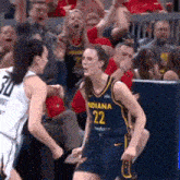 a female basketball player wearing a number 22 jersey