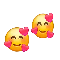 a couple of smiley faces with pink hearts on their faces