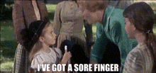 a little girl talking to a woman with the words i 've got a sore finger above her