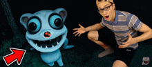 a man kneeling next to a cartoon character with an arrow pointing up