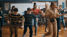 a group of children are dancing in front of a white board that says find the area of the circle